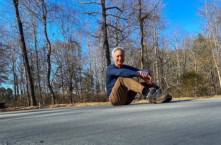 Joe on the site of his future greenhouse.