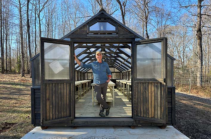 Joe Lamp'l with greenhouse