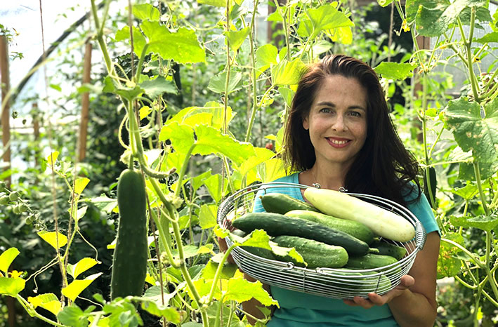 Season extension expert Niki Jabbour holding basket of veggies
