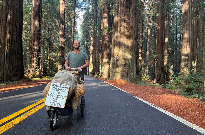 Robin Greenfield walking through Redwoods